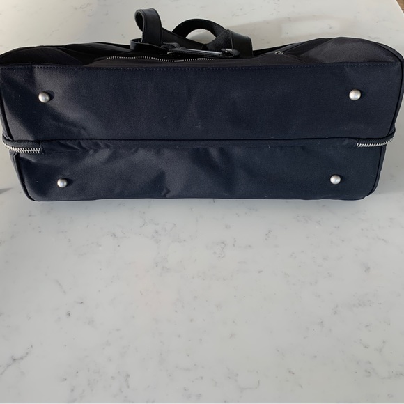 Black Travel Bag with Structured Design and Metal Feet - Picture 2 of 16